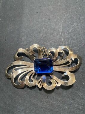 Silver Filigree Brooch with Deep Blue Stone